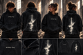 TRUTH WEAR Reborn Hoodie on male and female models with centered Hebrew front and dove cross back